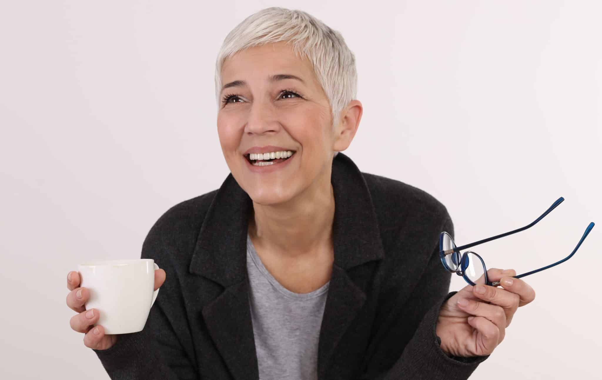 Happy laughing Mature Woman portrait isocated on white. Positivity concept anti aging wrinkle cream for older women